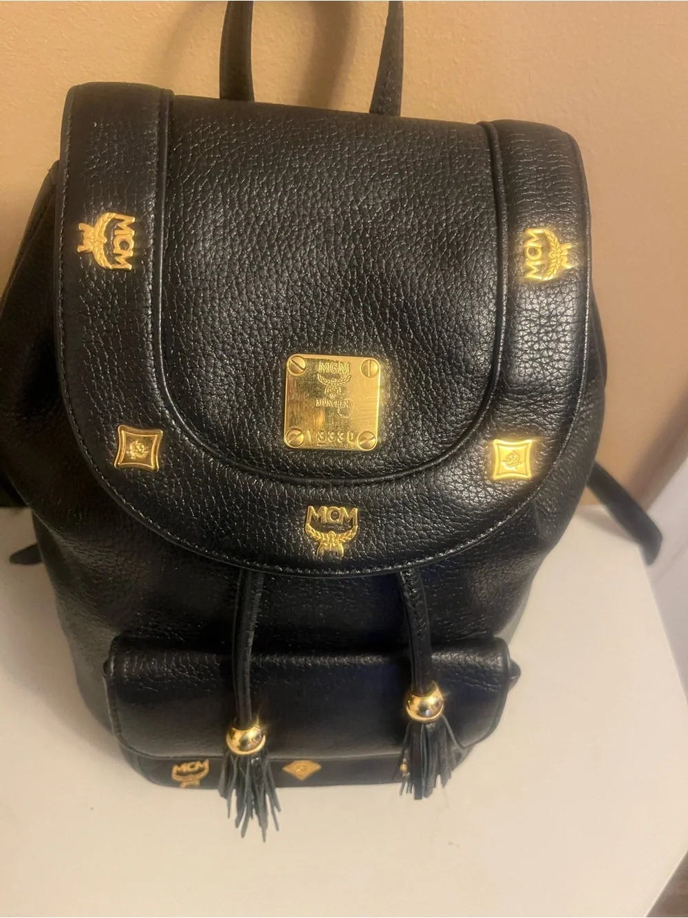 Vintage MCM Black Pebbled Leather Small Drawstring Backpack with Gold Hardware